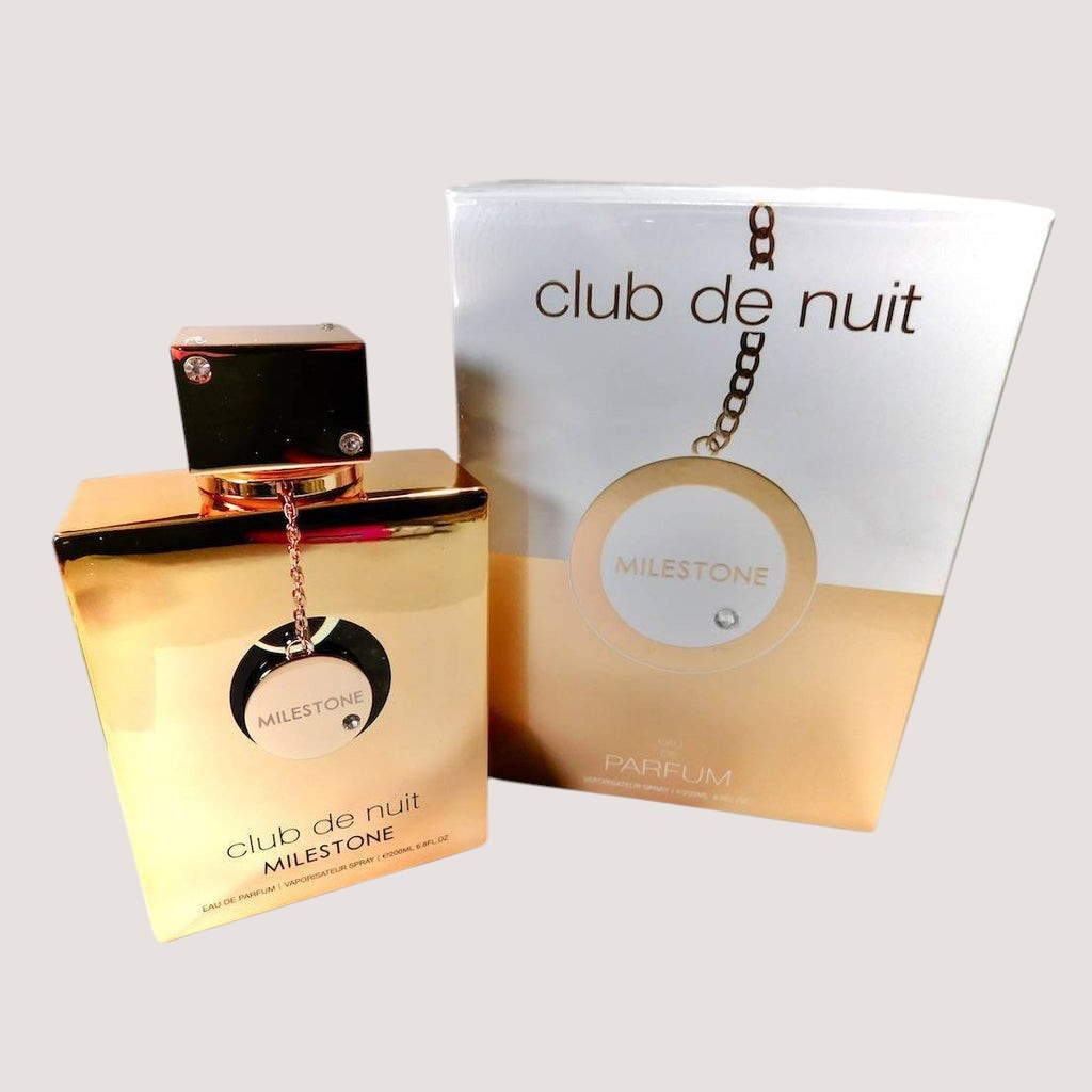 Perfume unisex Armaf Club de Nuit Milestone en frasco dorado brillante con caja de presentación de Oasis Perfumes Honduras Mayoreo