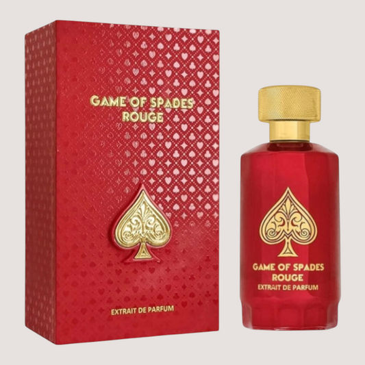 Perfume unisex Jo Milano Game of Spades Rouge en frasco rojo con tapón dorado y caja decorada con motivos de picas.